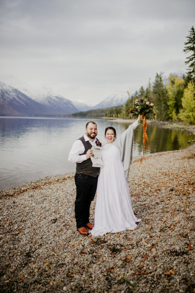 Lake McDonald in Glacier national park with bride and groom celebrating