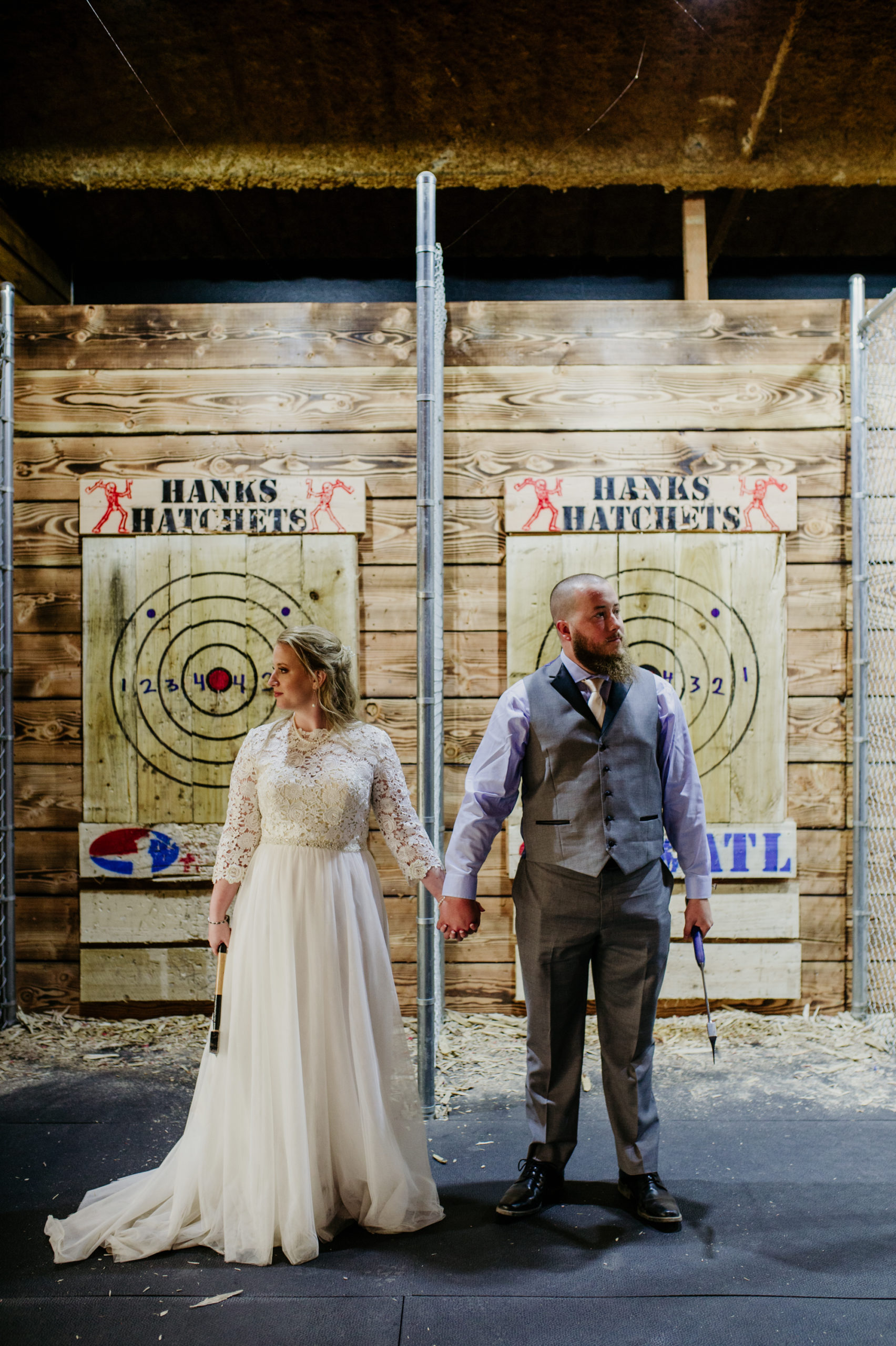 bride and groom throwing axes at Hanks Hatchets