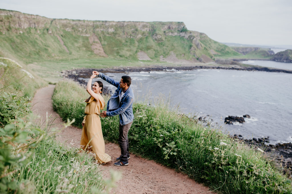 Ireland is MADE for adventure elopements, and we are made to capture your elopement at the top of those mountains!! If you’re looking to elope in the mountains, we can’t wait to help make your dreams come true. Check out our list of our Top 10 Mountain Elopement Locations Worldwide (must-see hikes included!). couples adventure session in Giant's Causeway Ireland where to elope in Ireland. Giant’s Causeway couple session.