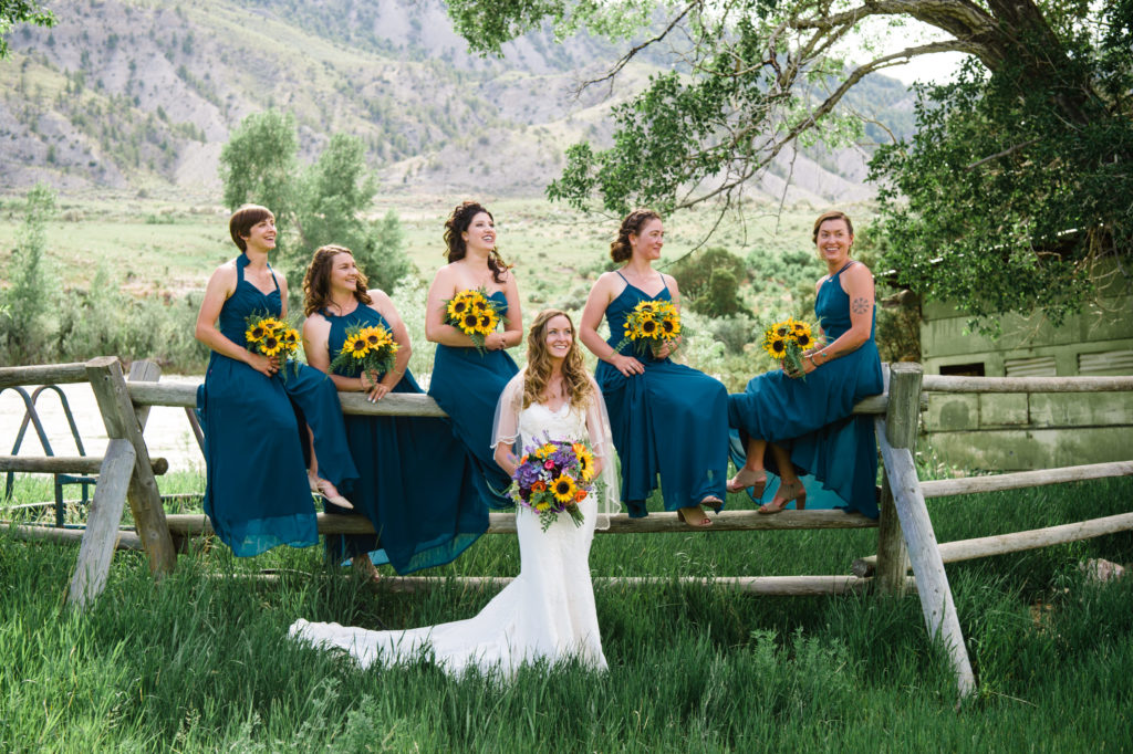 bridesmaid dresses with sunflower bouquets in Yellowstone National Park Wedding