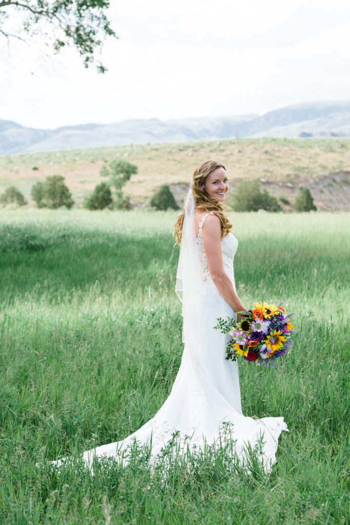 Wedding dress during Montana wedding, sunflower bouquet