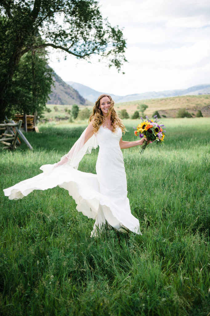 Wedding dress during Montana wedding, sunflower bouquet. Elope in a national park!