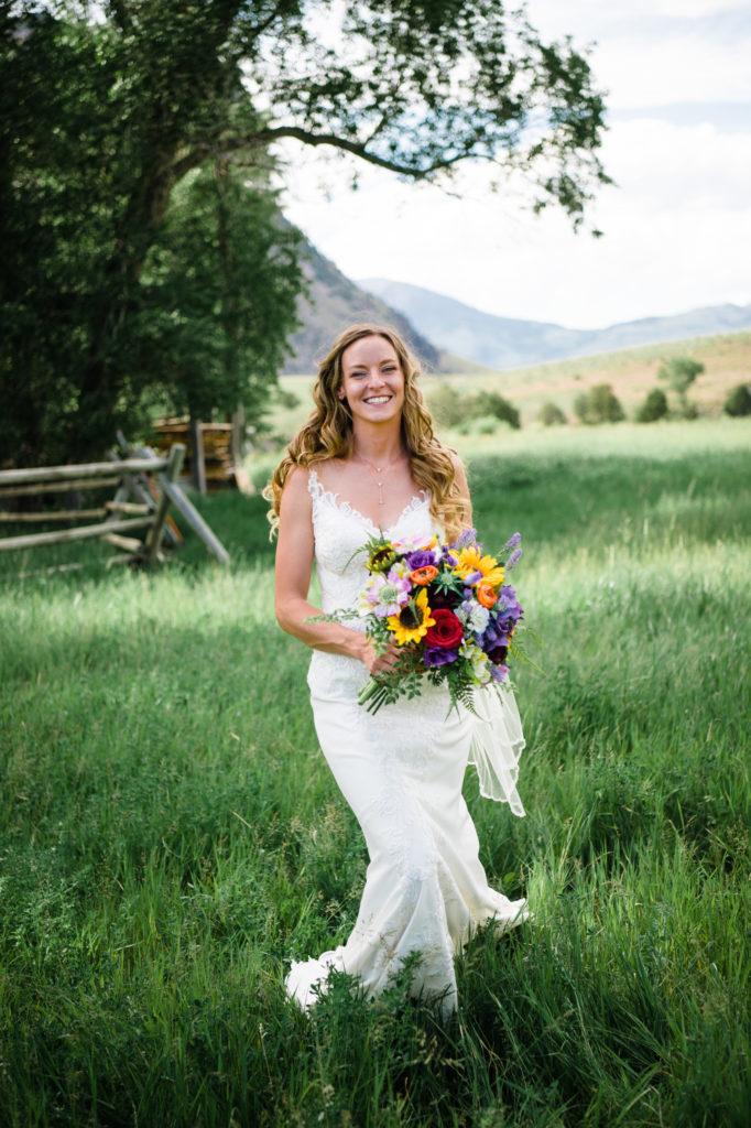 Wedding dress during Montana wedding, sunflower bouquet. Elope in a national park!