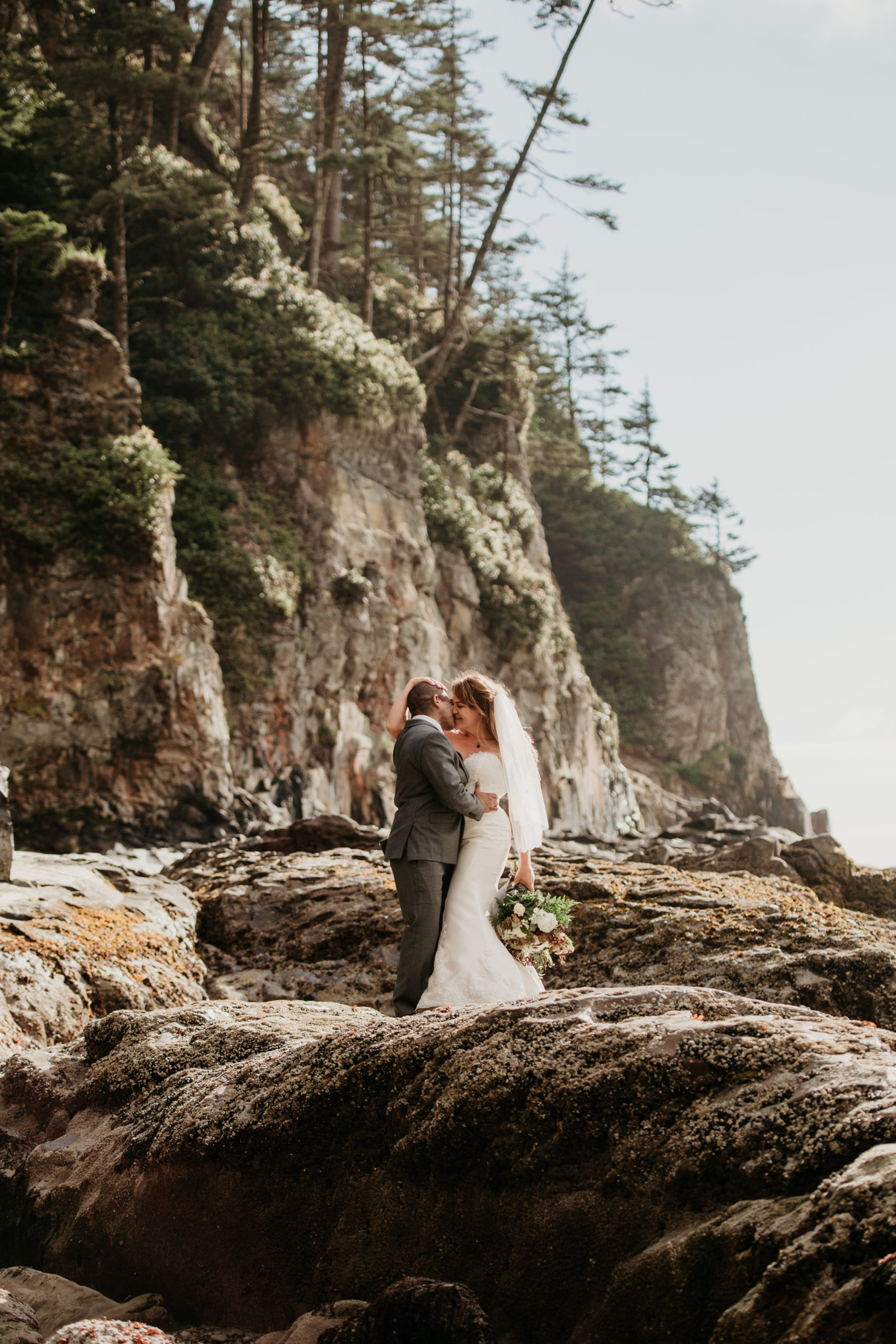 We love being an Oregon coast elopement photographer not only because of the gorgeous views, but the adventure that can happen in Oregon is one of our very favorite things! 

Are you ready for an Oregon coast elopement? We are shelling out all the info on the best of the Oregon coast. The three spots that capture our hearts in this blog are Hug Point, Arch Cape, and Cannon Beach. All of which are within a ten minute drive from each other! This stretch of magic is technically called "The North Coast" which stretches from the Columbia River to Cascade Head.
