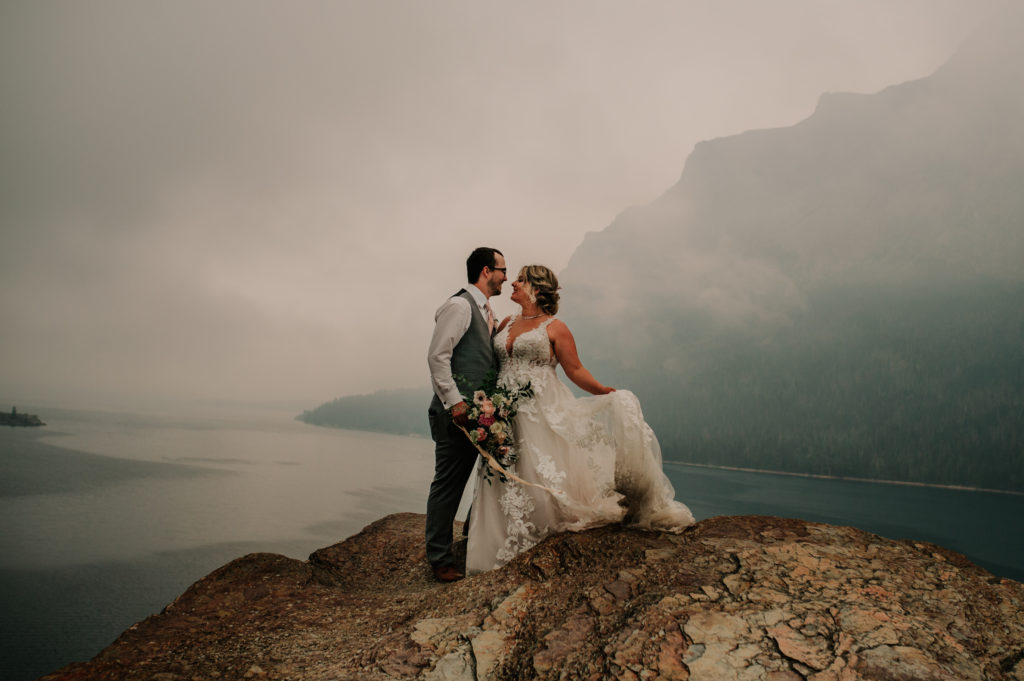 What are the benefits of eloping? We asked what are the reasons to elope from 20 of our real couples! Glacier National Park elopement at saint mary