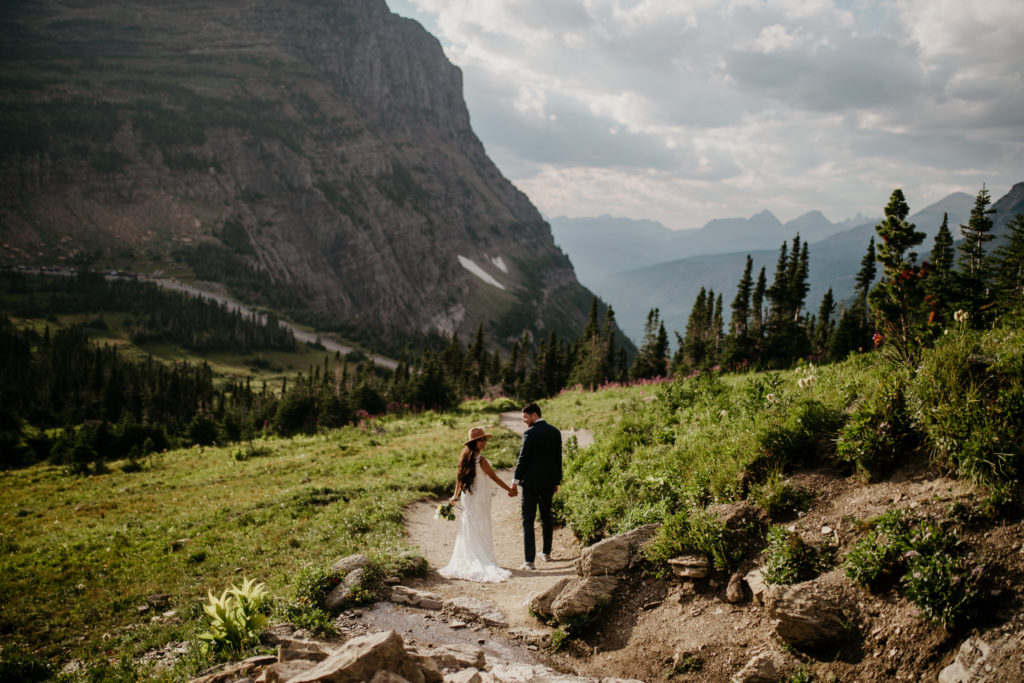 Glacier National Park in Montana is MADE for adventure elopements, and we are made to capture your elopement at the top of those mountains!! If you’re looking to elope in the mountains, we can’t wait to help make your dreams come true. Check out our list of our Top 10 Mountain Elopement Locations Worldwide (must-see hikes included!).  Glacier National Park in Montana is MADE for adventure elopements, and we are made to capture your elopement at the top of those mountains!! If you’re looking to elope in the mountains, we can’t wait to help make your dreams come true. Check out our list of our Top 10 Mountain Elopement Locations Worldwide (must-see hikes included!). Glacier National Park Adventure Session at Logan Pass Highline Trail