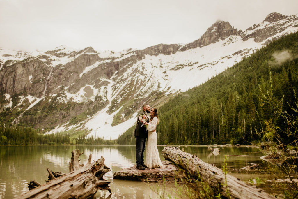 Glacier elopement with hike to avalanche lake. With a ceremony at Lake McDonald, a spring elopement in Glacier National Park was the perfect Montana wedding plan. 