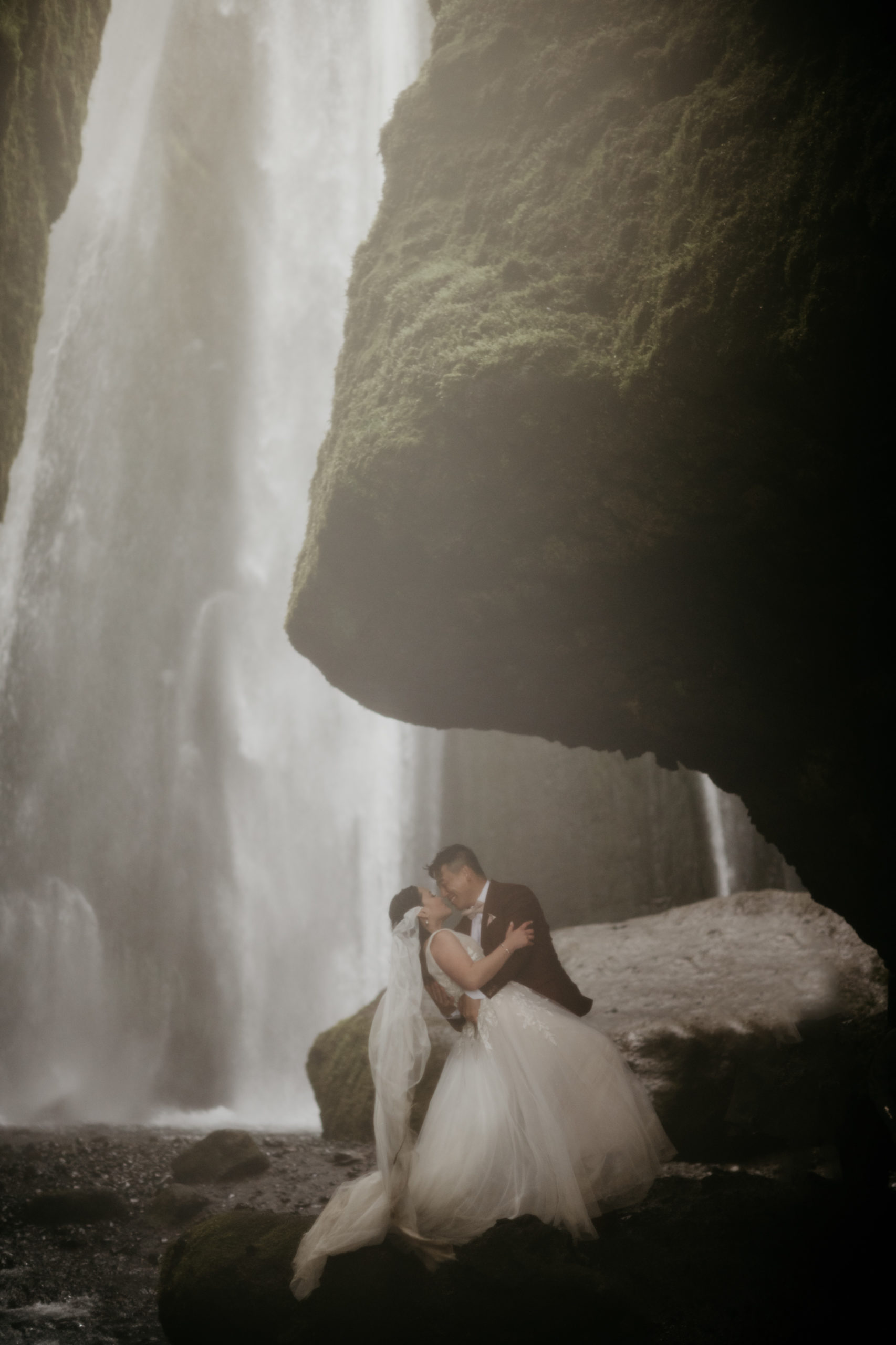 During their Iceland elopement at Reynisfjara, a bride and groom explored Skogafoss and seljalandsfoss. Iceland is a one of a kind and adventurous elopement location and MUST be explored! If you're wondering how to elope in Iceland, see how these two did it! 

Hidden waterfall at seljalandsfoss!