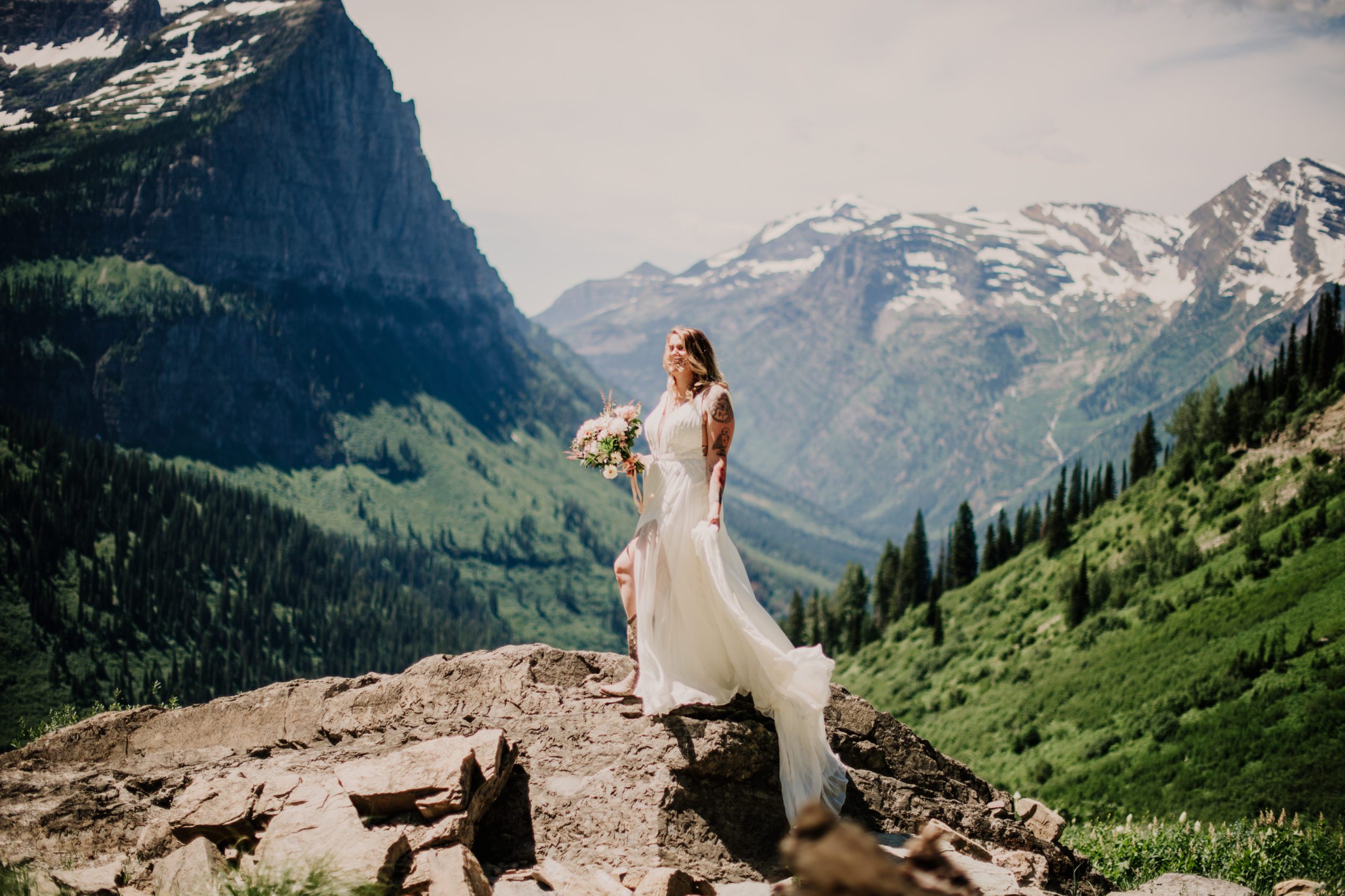 Glacier park elopement at Logan Pass. Bride and groom at Logan Pass in Glacier National Park. Going to the sun road. Where to get married in Glacier National Park. 