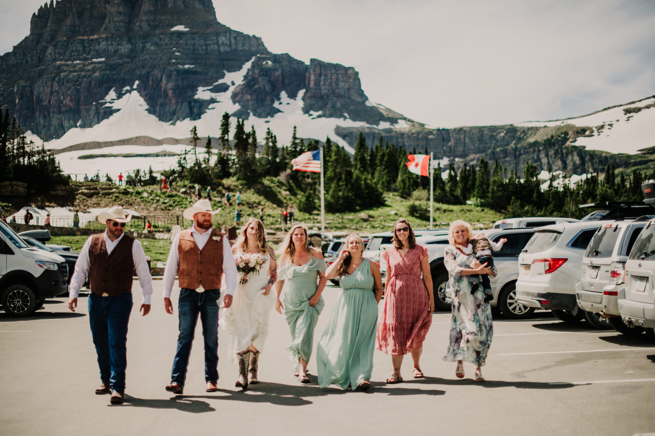 Glacier park elopement at Logan Pass. Hidden lake overlook elopement. Bride and groom at hidden lake overlook trail at Logan Pass in Glacier National Park. Where to get married in Glacier National Park. 