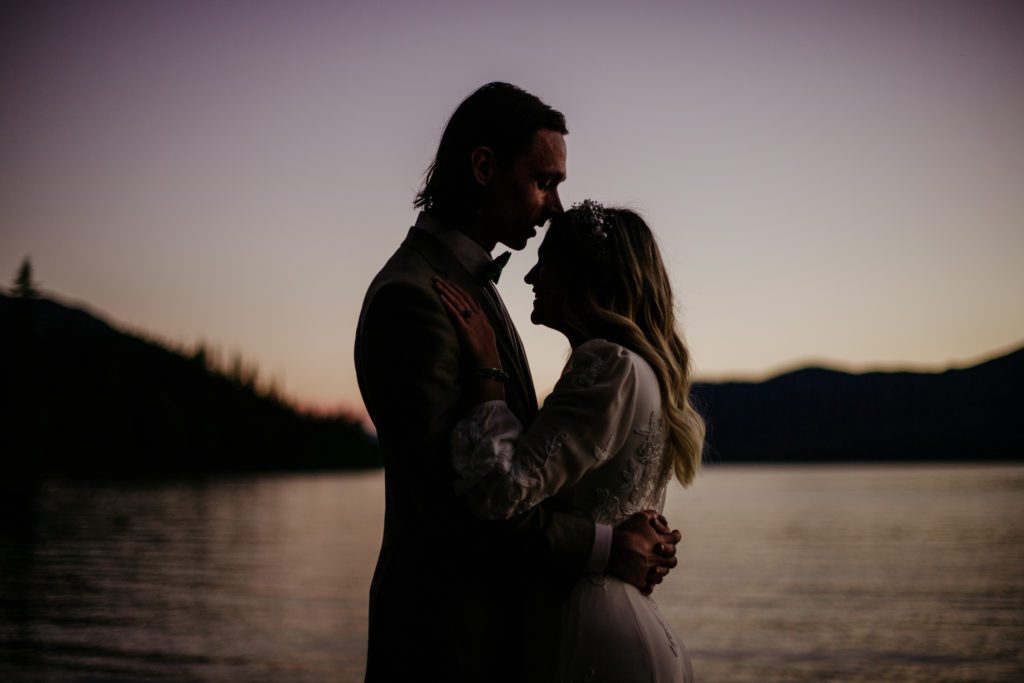 Best of 2022 elopement & wedding photography, Micro wedding in Glacier National Park in the summer. Best places for a micro wedding in Montana. Sunset photo of bride and groom. 
