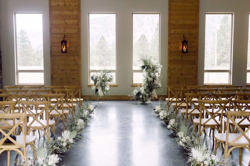 luxury winter elopement in Montana at White Raven. The best wedding venue in Montana is White Raven. Indoor ceremony inspiration.