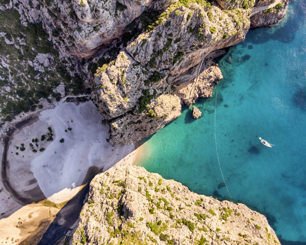 Have an eco friendly elopement by following these tips for conscious tourism.

Spain beach. 

Aerial view of Sa Calobra beach in Mallorca - Spain