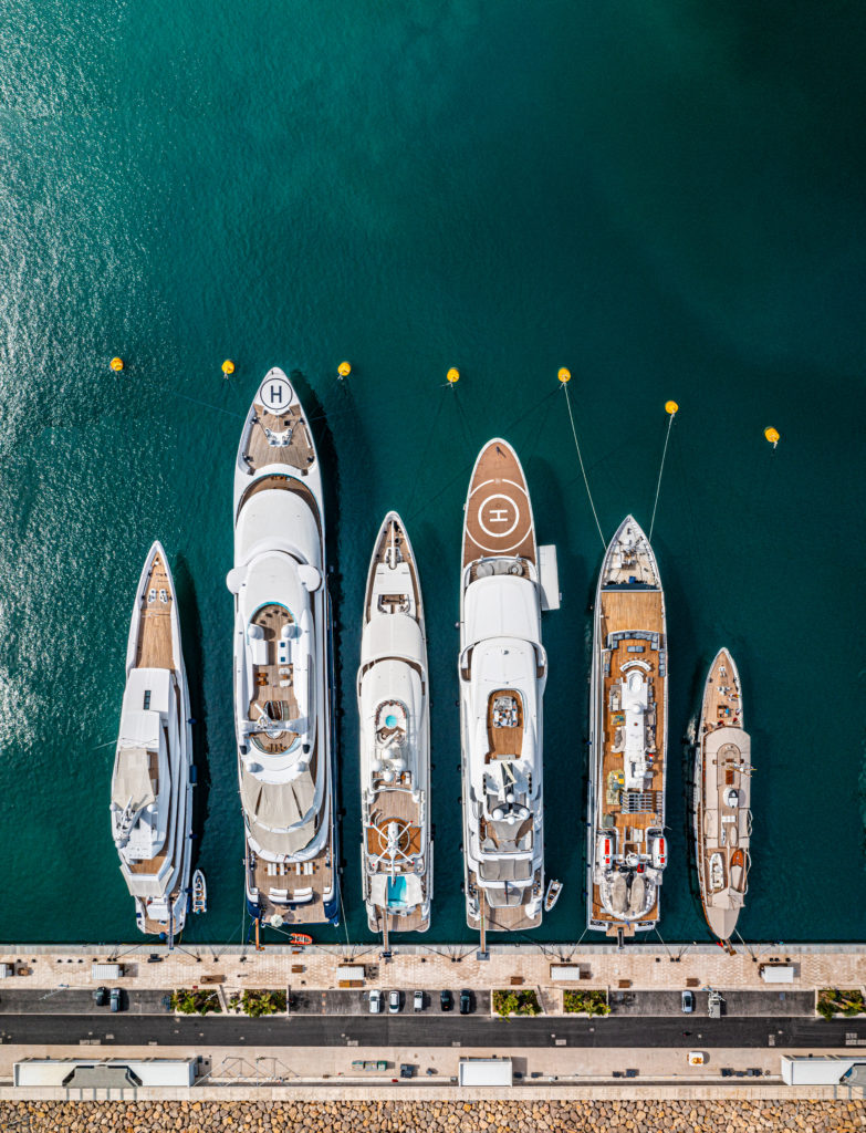 We share options for how to elope in a French chateau as an American and what to prepare. Eloping in Europe is a DREAM!

Aerial photo from a drone of a row of luxury super yachts moored in Port Vauban, Antibes, Cote D'Azur, France