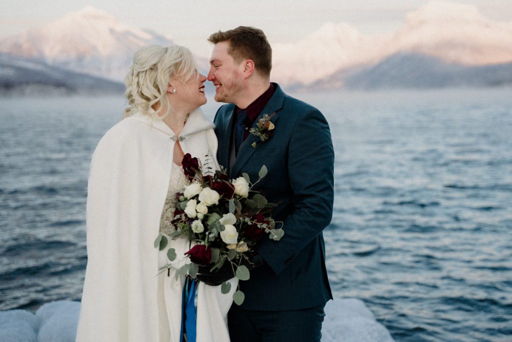 A Glacier National Park Winter Elopement is a one of a kind wedding featuring frozen docks, epic sunsets, and steaming lakes. See the best of Glacier Park!