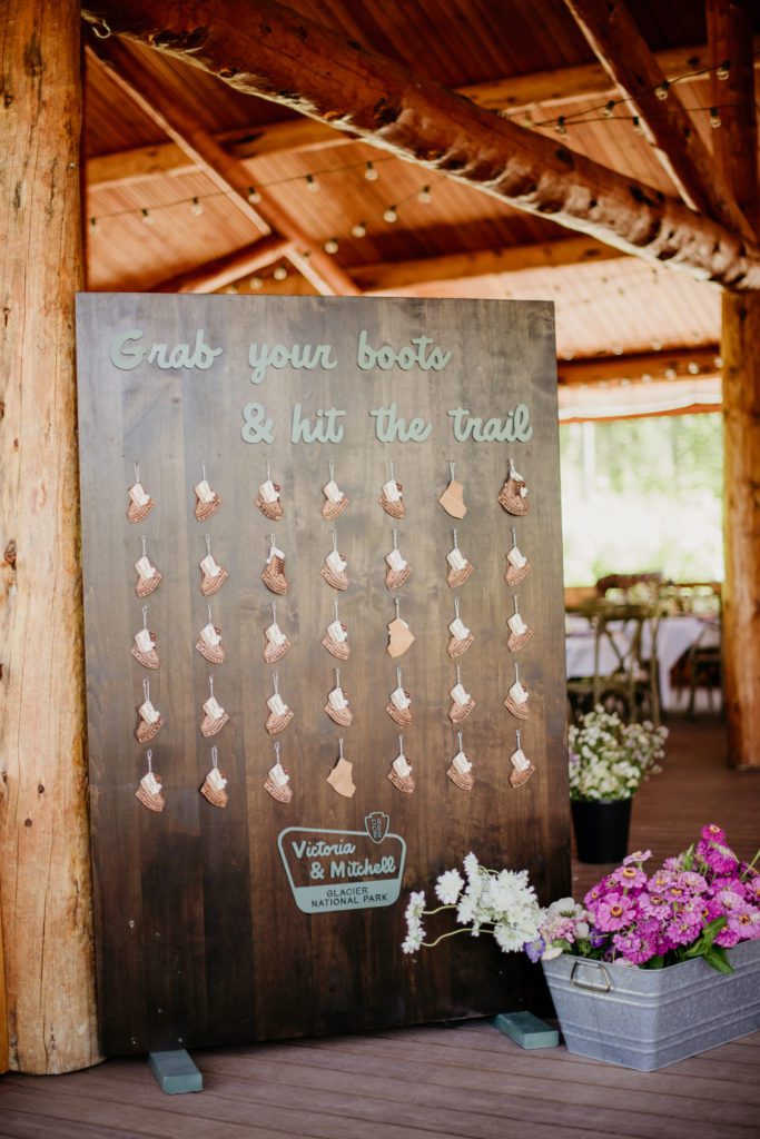 Best of 2022 elopement & wedding photography, Montana wedding photographer at Glacier Outdoor Center. The closest wedding venue to Glacier National Park is Glacier Outdoor Center. Creative hiking themed seating chart for a wedding.