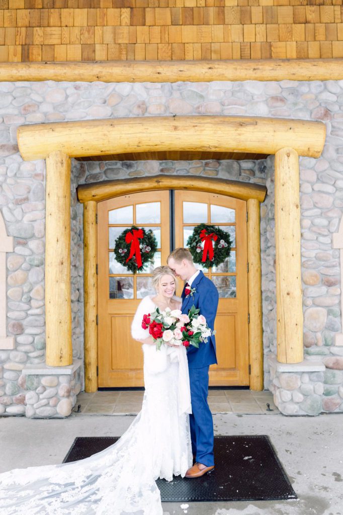 Rainbow Ranch winter wedding in Big Sky Montana. Bride with a white fur outside on her winter wedding day. 

Best ways to use Christmas decor for a wedding.