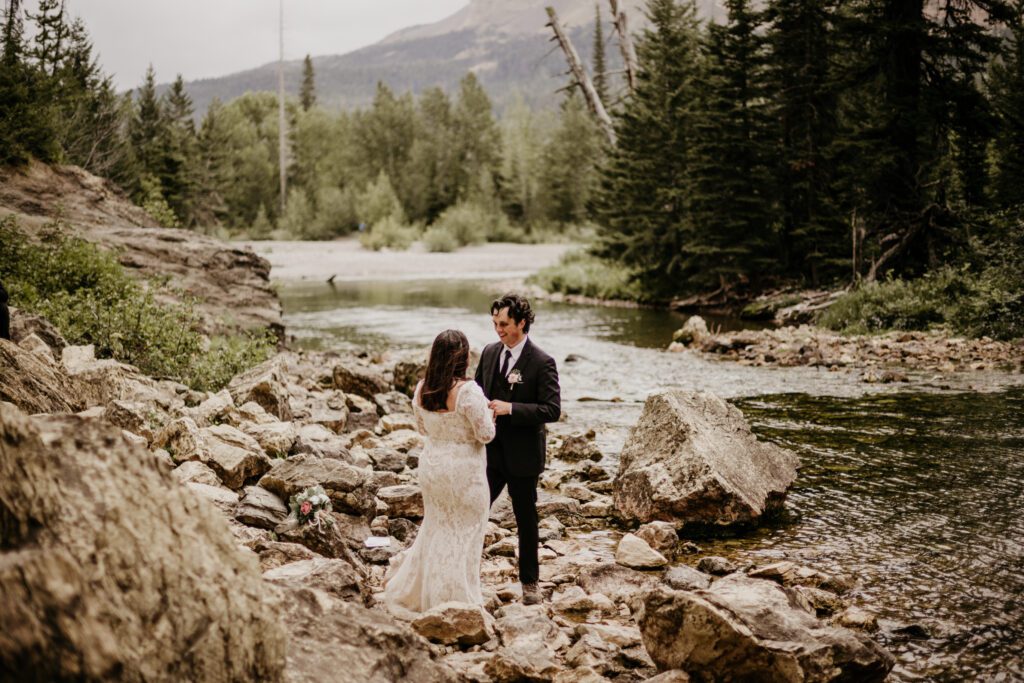 4 ways that this Texas couple came to Montana and did their elopement THEIR OWN WAY! Fall, moody Glacier elopement at Two Medicine! Running Eagle Falls, Glacier National Park. 