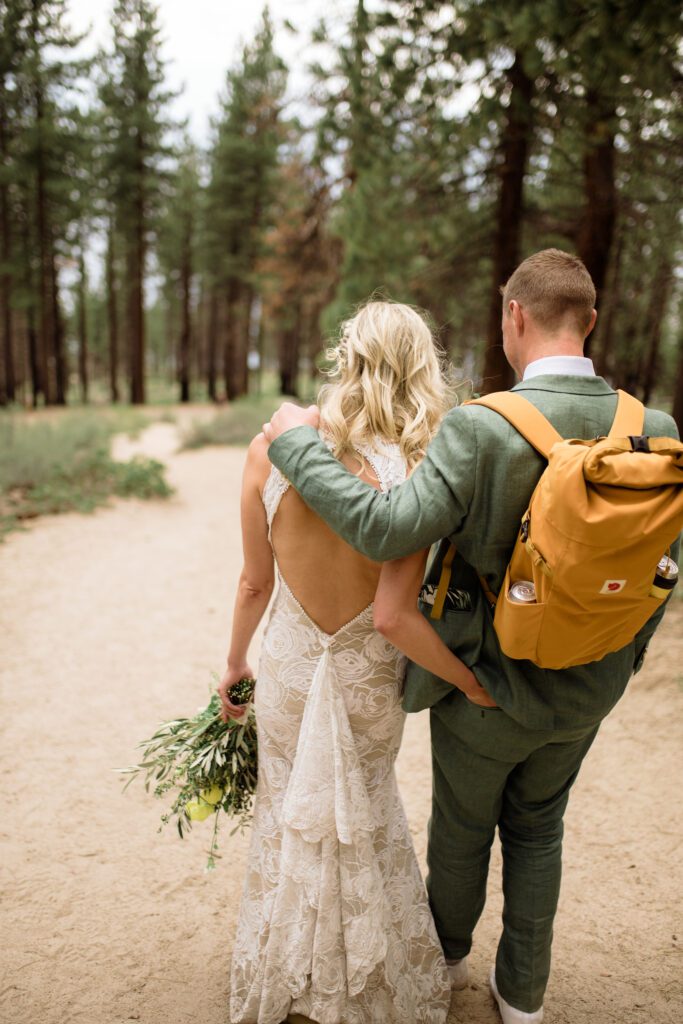 Have an eco friendly elopement by following these tips for conscious tourism.

Hiking elopement couple hike with their wedding clothes and backpack. 