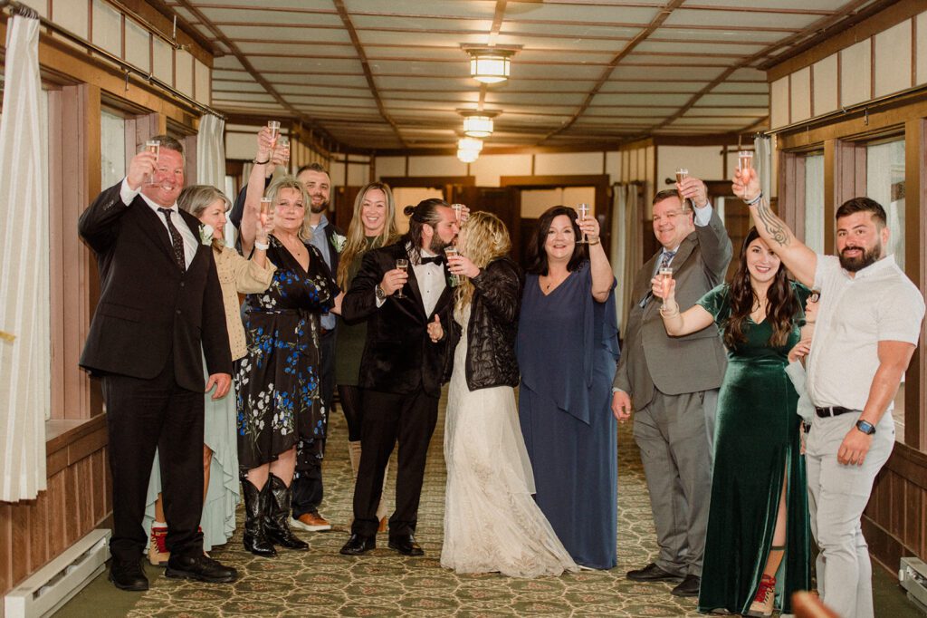 toasting to Many Glacier Hotel Micro Wedding