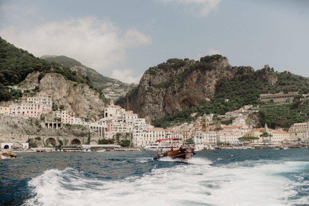 Discover 16 dreamy and romantic activities for couples in Italy private boat ride to capri. Couple on a boat ride to Amalfi Coast.