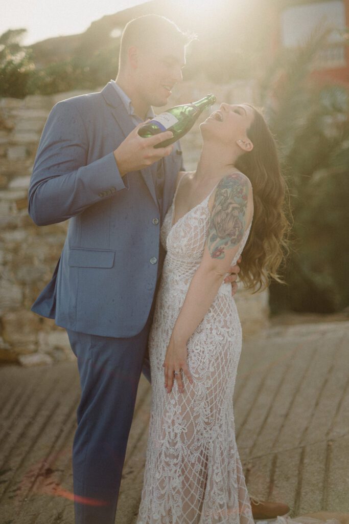 Part one of our Ultimate 2024 Greece Guide, Elope in Greece breaks down the cost, legality, planning and outlines a two day Greece elopement.

Married couple share champagne on Crete, Greece