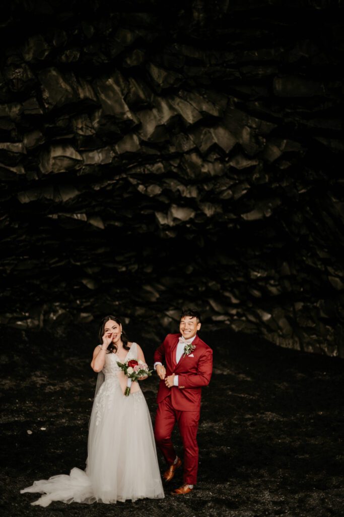 couple having wedding ceremony in a cave. Inspiration picture for an elopement in Greece cave.