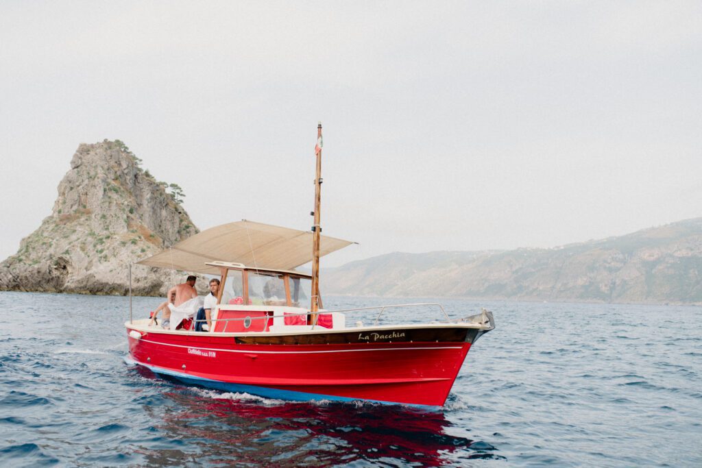Part one of our Ultimate 2024 Greece Guide, Elope in Greece breaks down the cost, legality, planning and outlines a two day Greece elopement.

red boat in sea