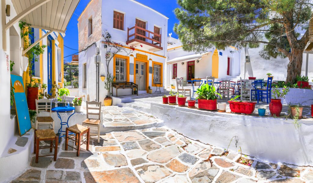 Elope in Greece with current information on Athens, Folegandros, Paros, and Lemnos for 2024 ultimate travel.

Beautiful Lefkes traditional greek village in Paros island. Charming coffe bars and taverns in colorful narrow streets. Cyclades , Greece