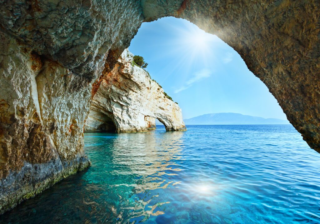 Sunshine in Blue Cave arch view from boat (Zakynthos, Greece, Cape Skinari ). Beautiful for a Greece elopement.