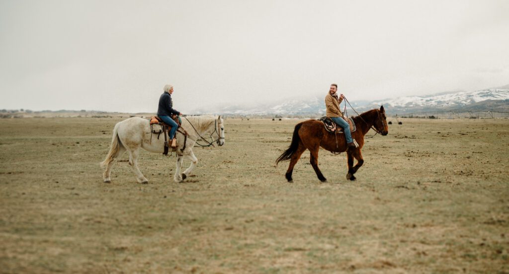 dreamy Montana engagement session with horses, Bozeman engagement session with a western theme