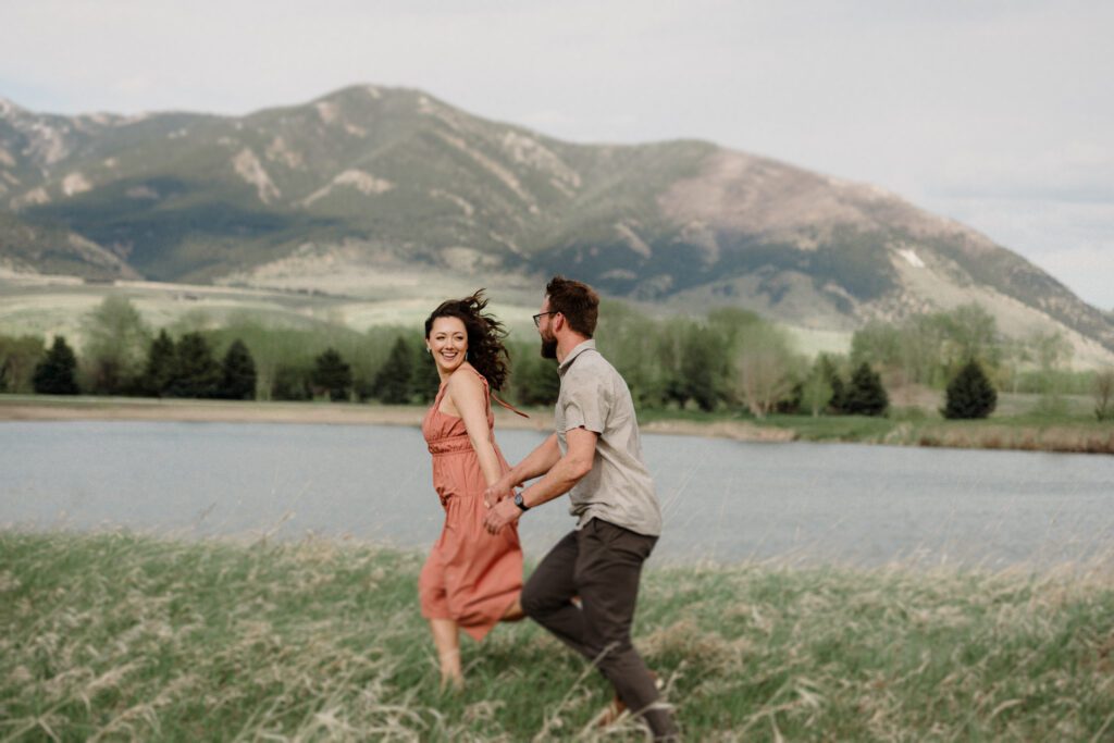 engagement session in Bozeman with mountain views, aspen trees, and candid engagement session photos