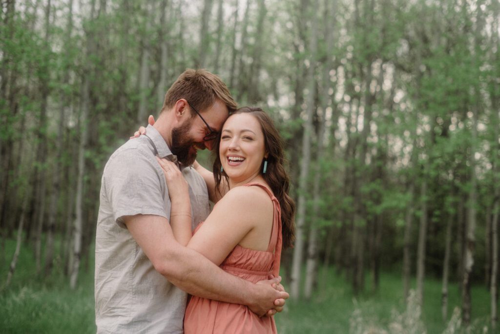 engagement session in Bozeman with mountain views, aspen trees, and candid engagement session photos