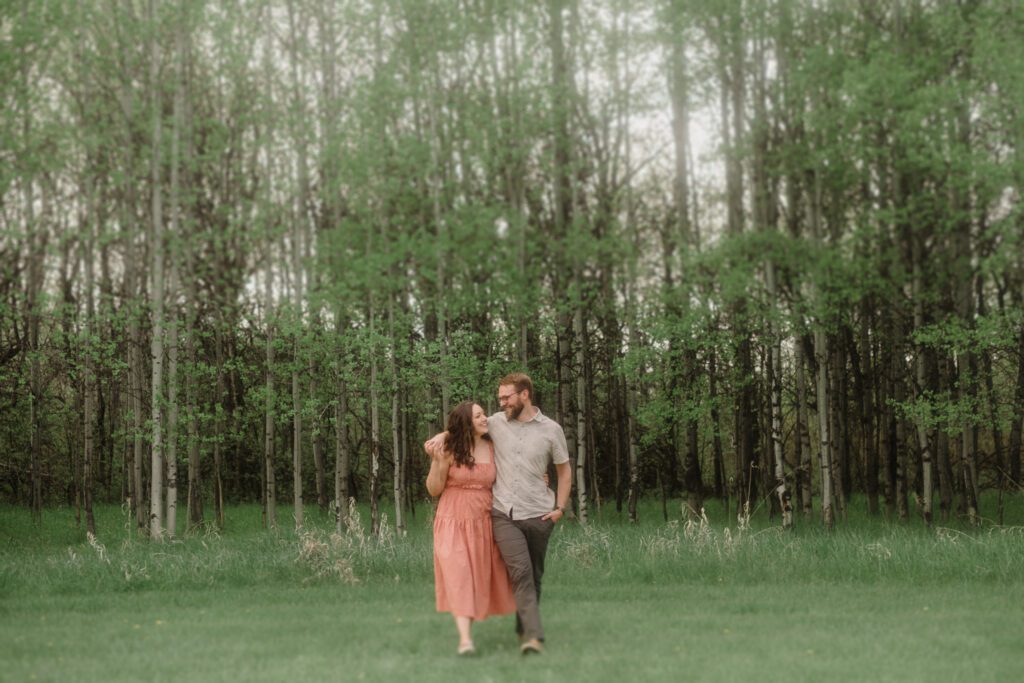 engagement session in Bozeman with mountain views, aspen trees, and candid engagement session photos