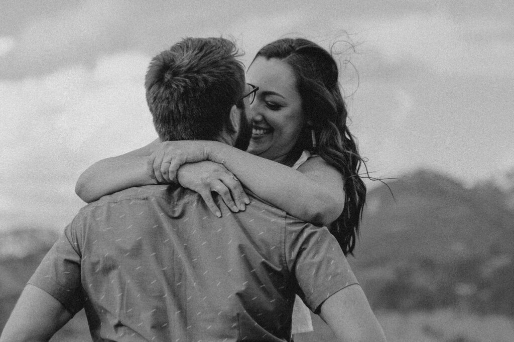 engagement session in Bozeman with mountain views, aspen trees, and candid engagement session photos