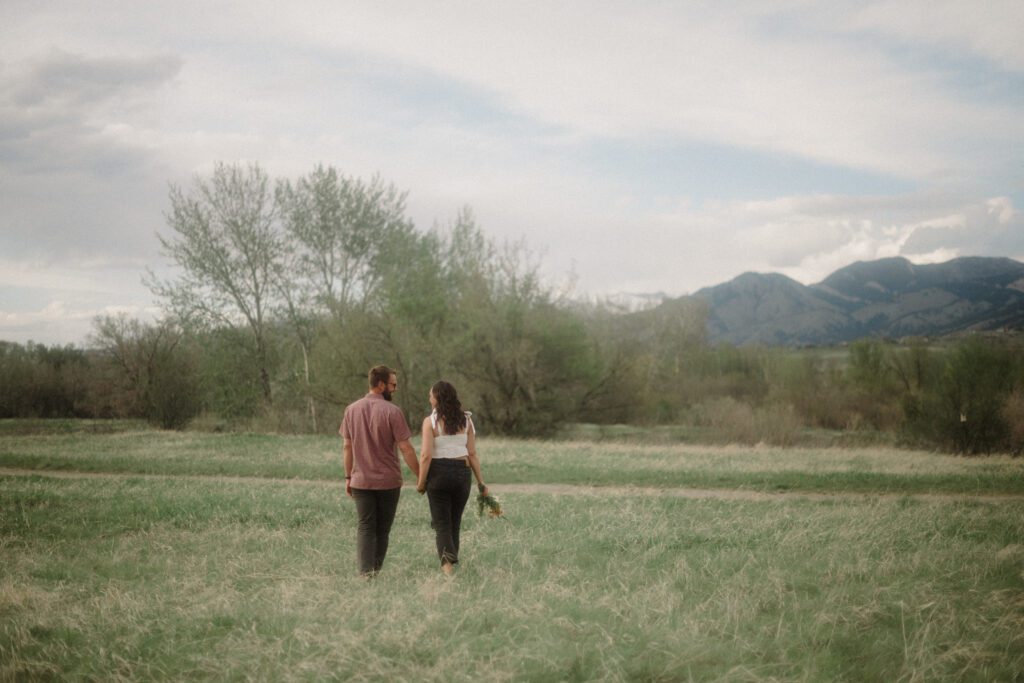 engagement session in Bozeman with mountain views, aspen trees, and candid engagement session photos