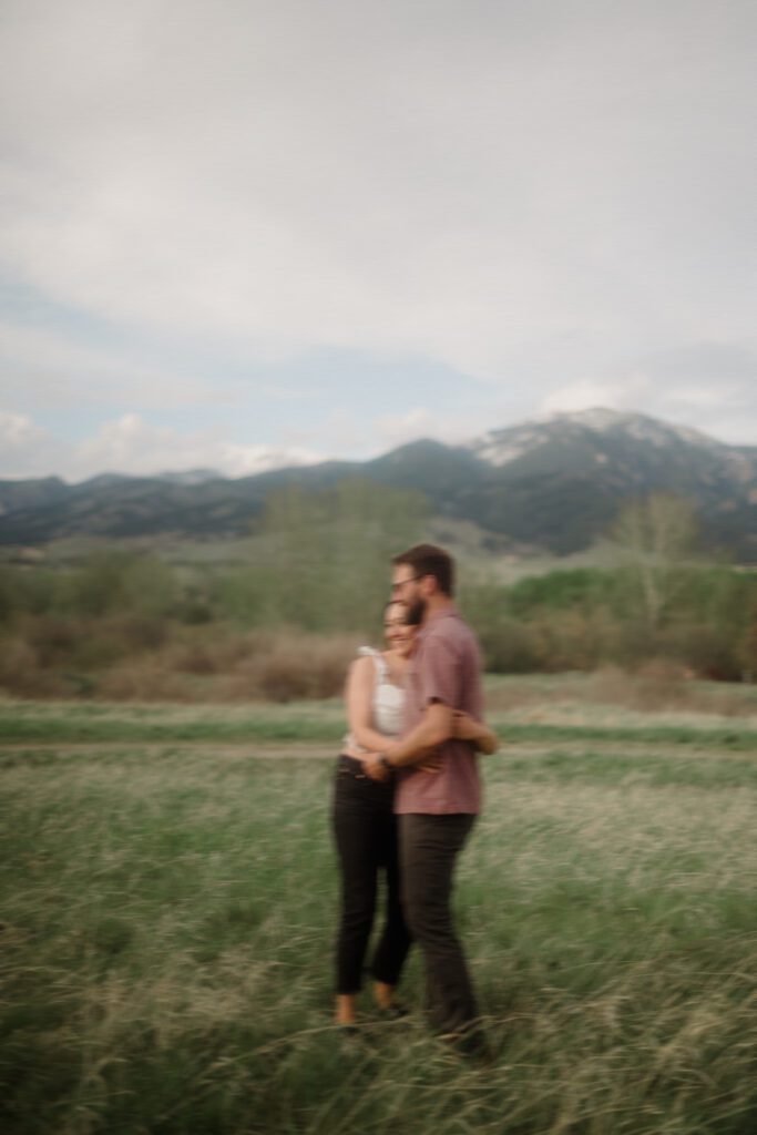 engagement session in Bozeman with mountain views, aspen trees, and candid engagement session photos