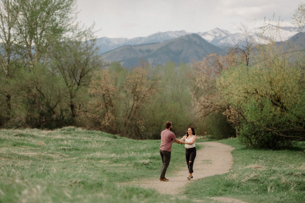 engagement session in Bozeman with mountain views, aspen trees, and candid engagement session photos