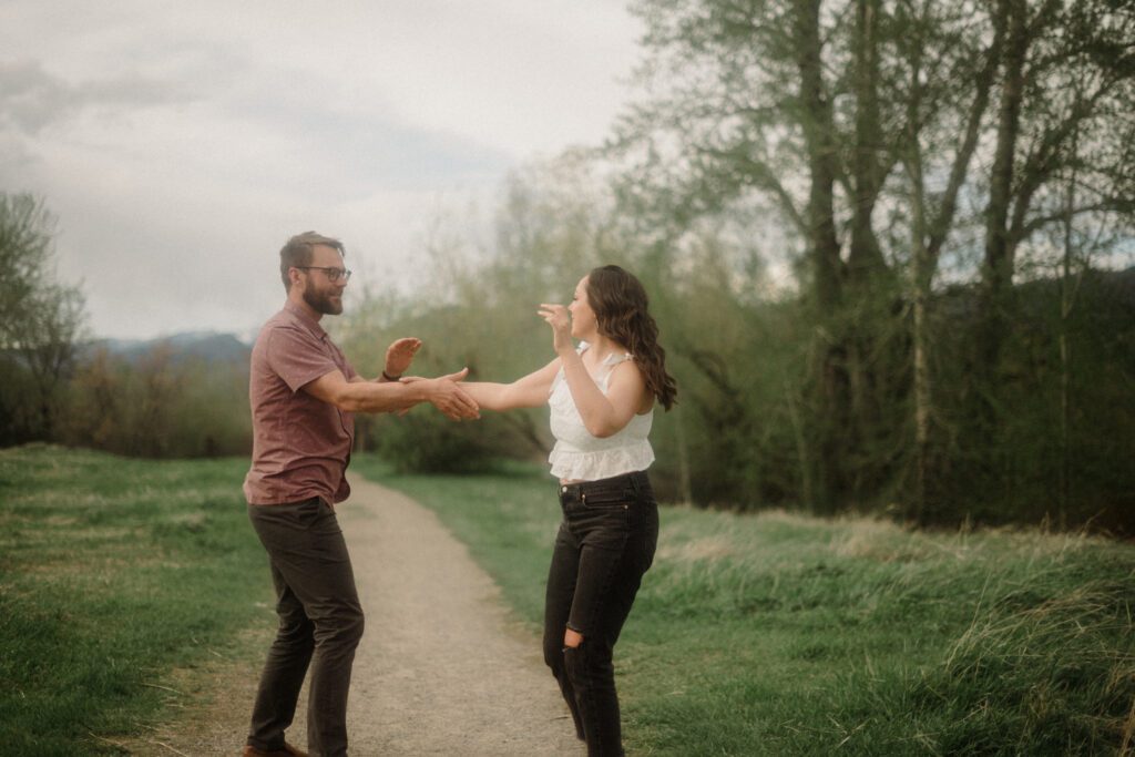 engagement session in Bozeman with mountain views, aspen trees, and candid engagement session photos