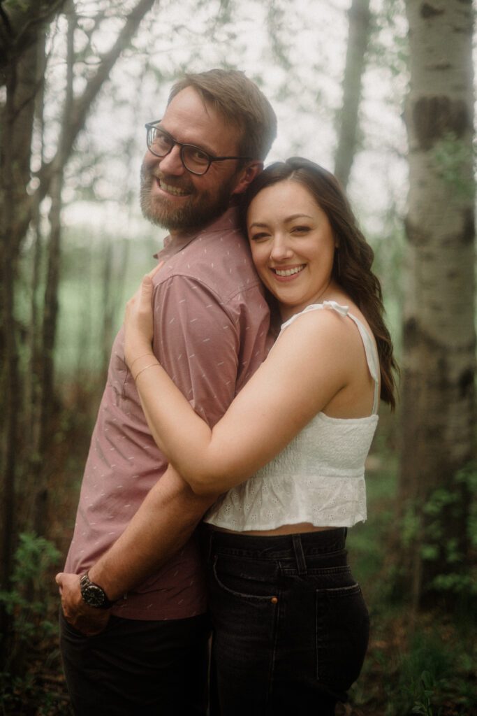 engagement session in Bozeman with mountain views, aspen trees, and candid engagement session photos