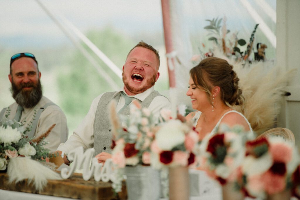 A stunning Little Smith Creek Ranch wedding in the Bitterroot Valley with breathtaking views, heartfelt moments, and a charming rustic theme. Best speeches reaction photo at a wedding.