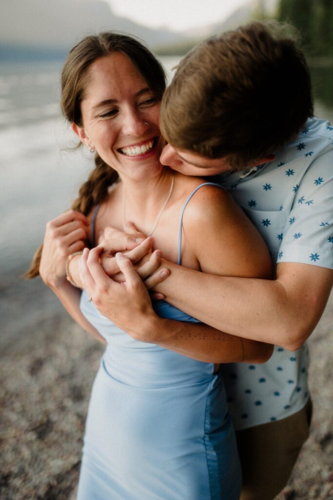 Deal with Wedding Stress, man behind a woman holding her in an embrace.