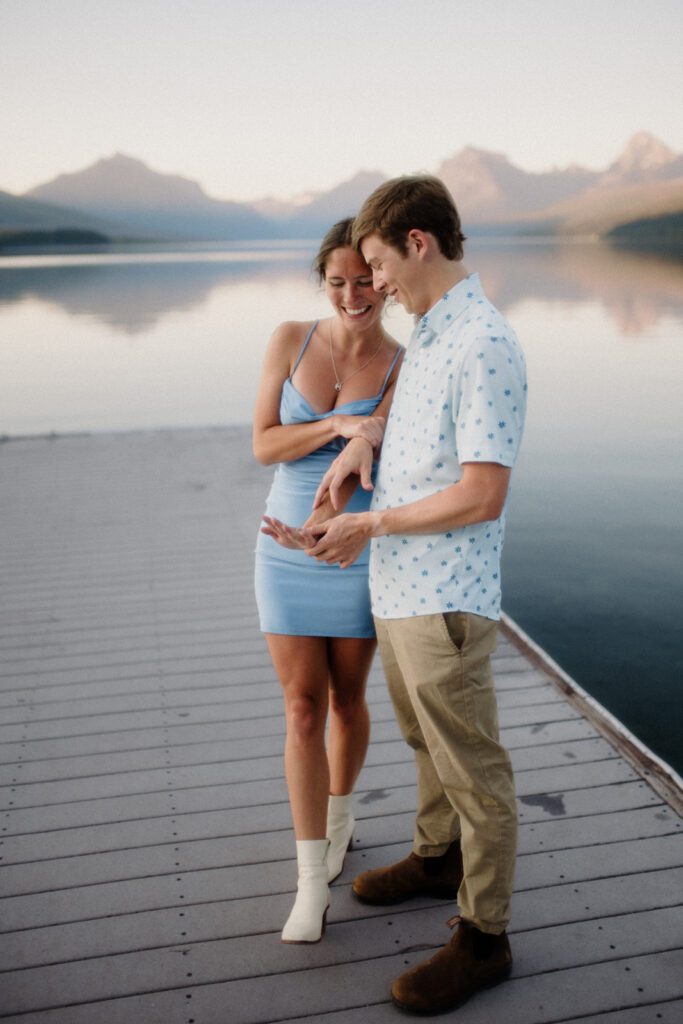 How to Propose in Montana at the top of a mountain without a hike! Couple on wedding day with mountains and clouds in the background. 