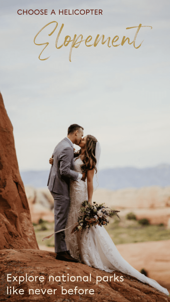 Have a helicopter elopement and explore national parks like never before! Wedding couple kissing in Arches national park.