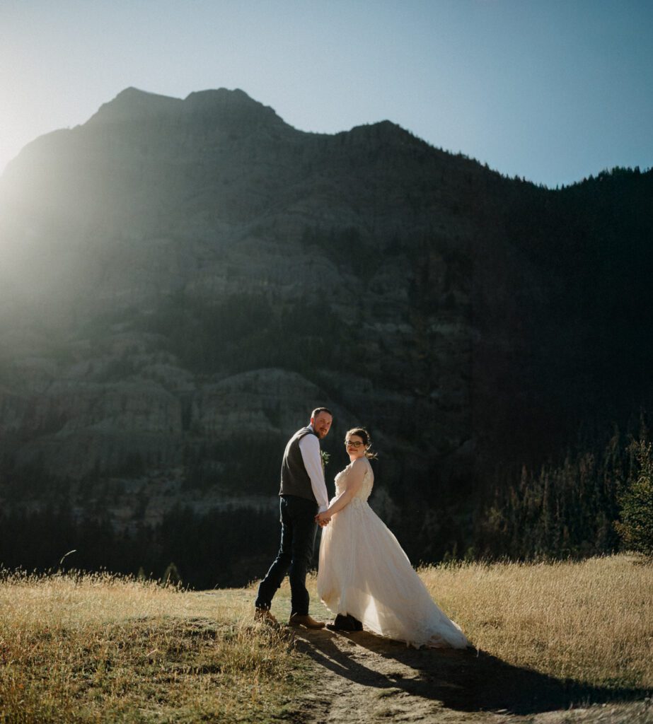 A stunning Yellowstone National Park elopement with intimate moments, breathtaking views and of course the perfect wedding guests- BUFFALO!

Gorgeous wedding photos at sunset in Yellowstone National Park.