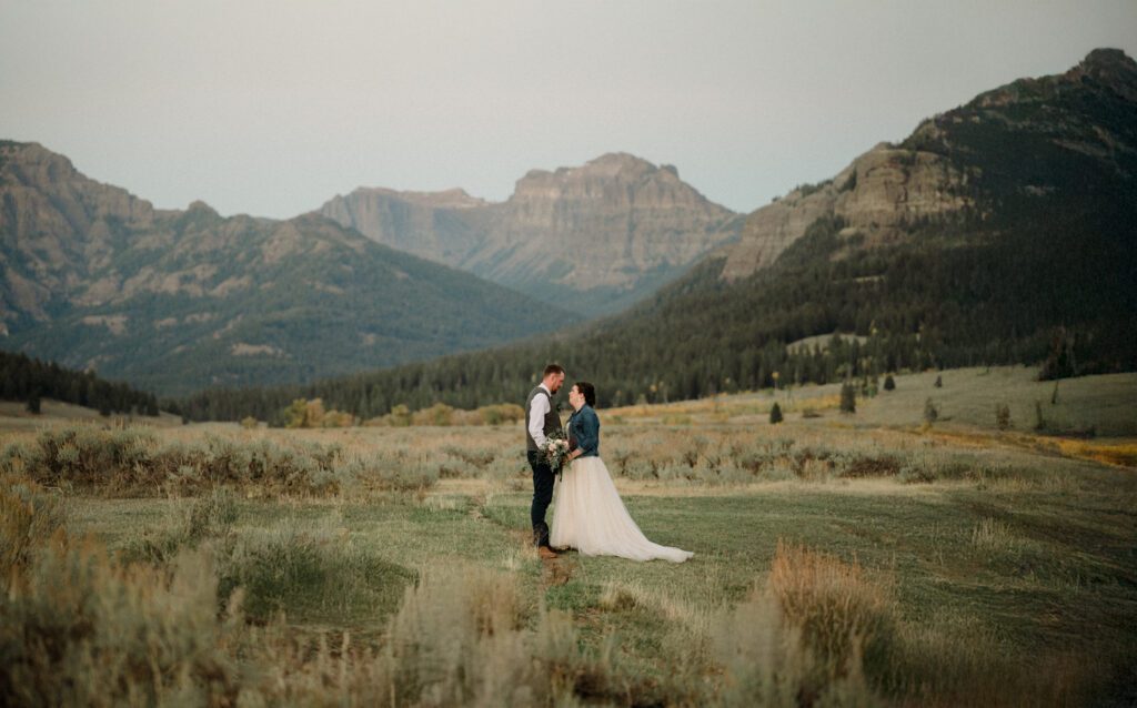 A stunning Yellowstone National Park elopement with intimate moments, breathtaking views and of course the perfect wedding guests- BUFFALO!

Gorgeous wedding photos at sunset in Yellowstone National Park.