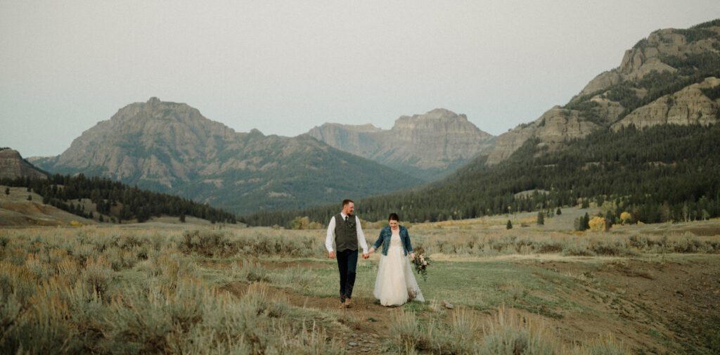 A stunning Yellowstone National Park elopement with intimate moments, breathtaking views and of course the perfect wedding guests- BUFFALO!

Gorgeous wedding photos at sunset in Yellowstone National Park.