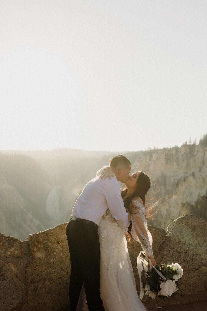 Plan your dream elopement in Yellowstone! Breathtaking views at Artist Point and stunning memories captured by our photographers await you! 