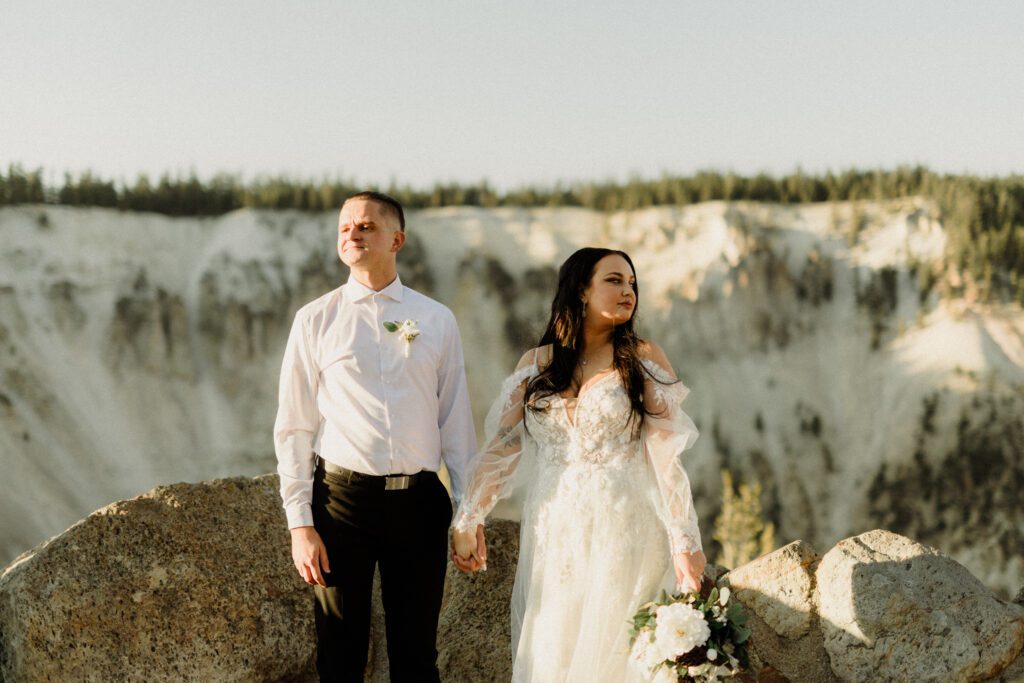 Plan your dream elopement in Yellowstone! Breathtaking views at Artist Point and stunning memories captured by our photographers await you! 