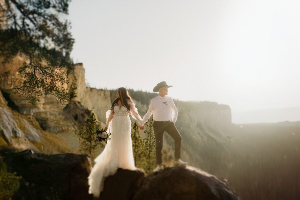 Plan your dream elopement in Yellowstone! Breathtaking views at Artist Point and stunning memories captured by our photographers await you! 